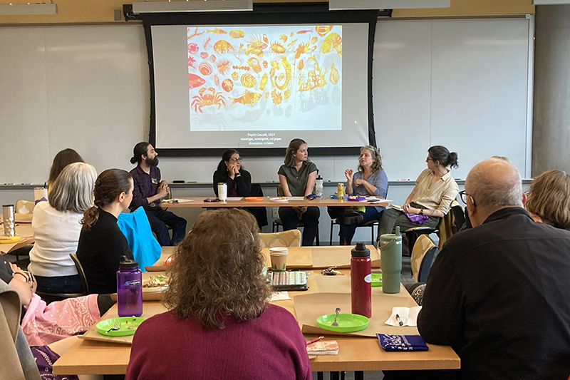 Faculty members in discussion