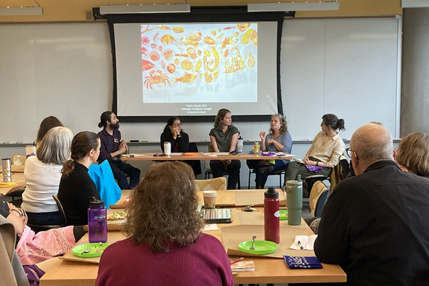 Faculty members in discussion