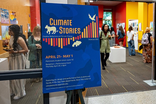 Students walk through showcase gallery
